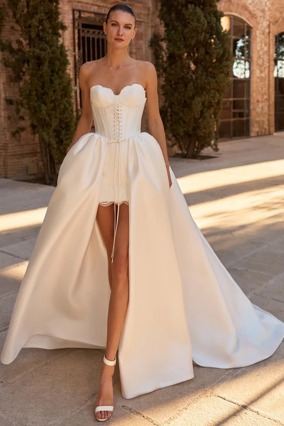 Front view of Pronovias Spicket lace mini wedding dress with detachable overskirt