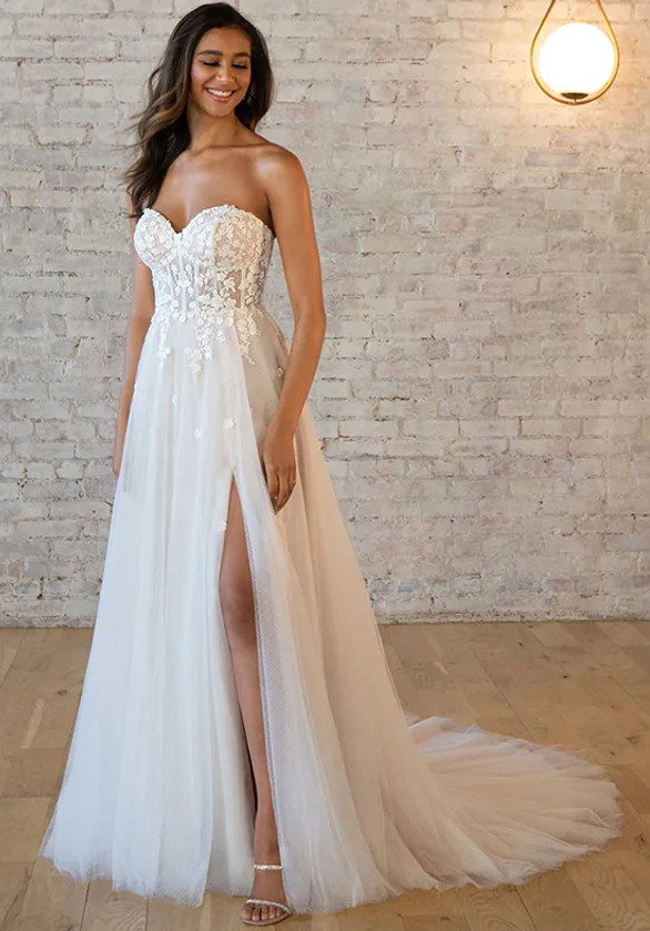 Strapless corset bodice with floral lace and a sultry A-line tulle skirt with slit Strapless corset bodice with floral lace and a sultry A-line tulle skirt with slit