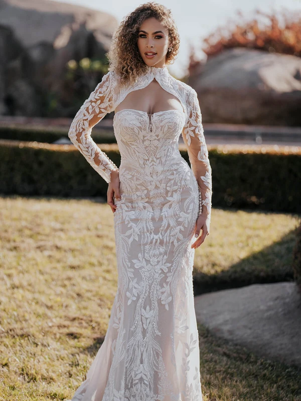 Front view of Allure Bridals A1168 fitted lace dress with long sleeve bolero