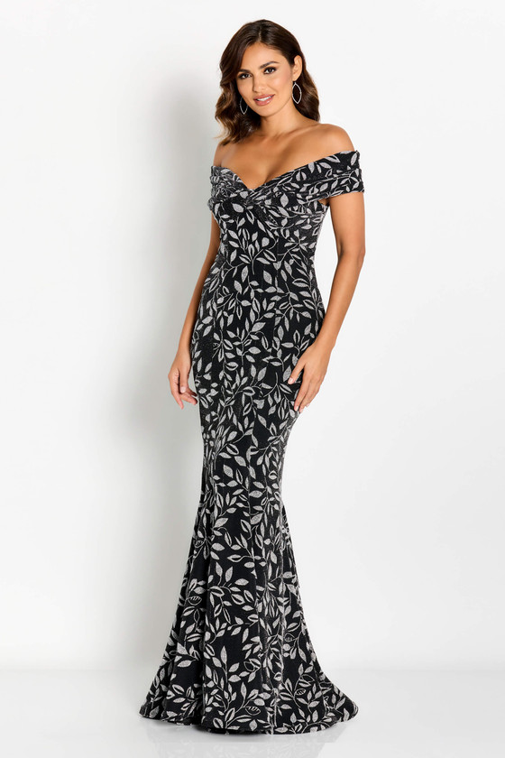 Leaf-patterned glitter fabric wraps this off-shoulder black gown in glam texture