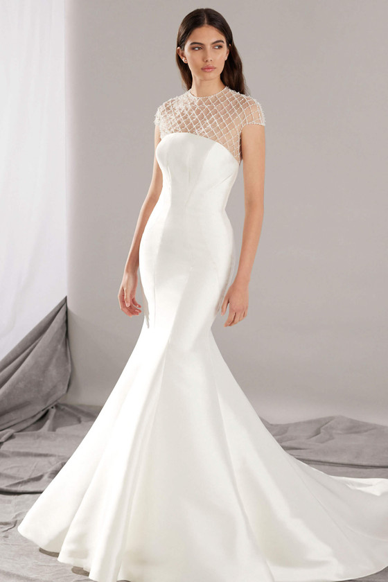 Sculpted mermaid gown with a structured bodice and an embellished illusion neckline Sculpted mermaid gown with a structured bodice and an embellished illusion neckline