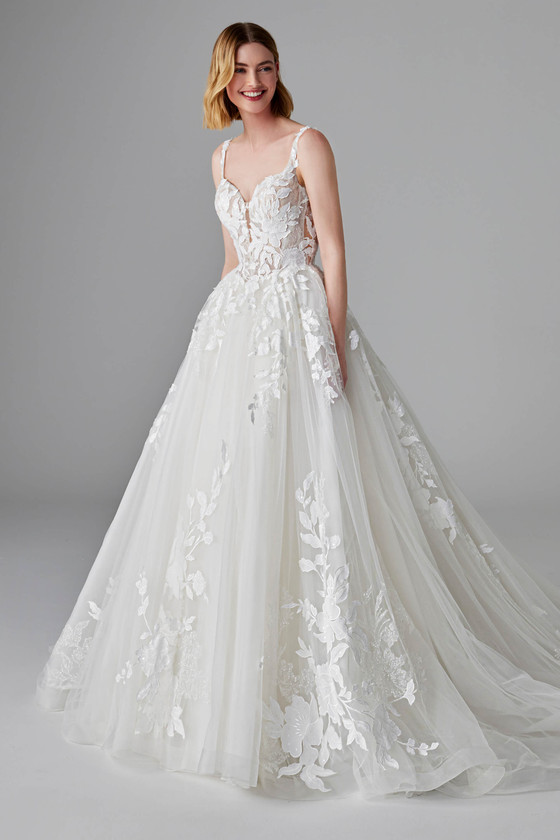 Romantic tulle ball gown with sheer bodice, floral appliqués, and delicate straps for a soft finish Romantic tulle ball gown with sheer bodice, floral appliqués, and delicate straps for a soft finish