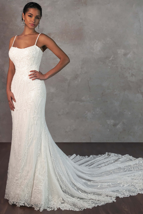 Intricate beading and delicate straps meet a sweeping lace train for an effortlessly elegant look Intricate beading and delicate straps meet a sweeping lace train for an effortlessly elegant look