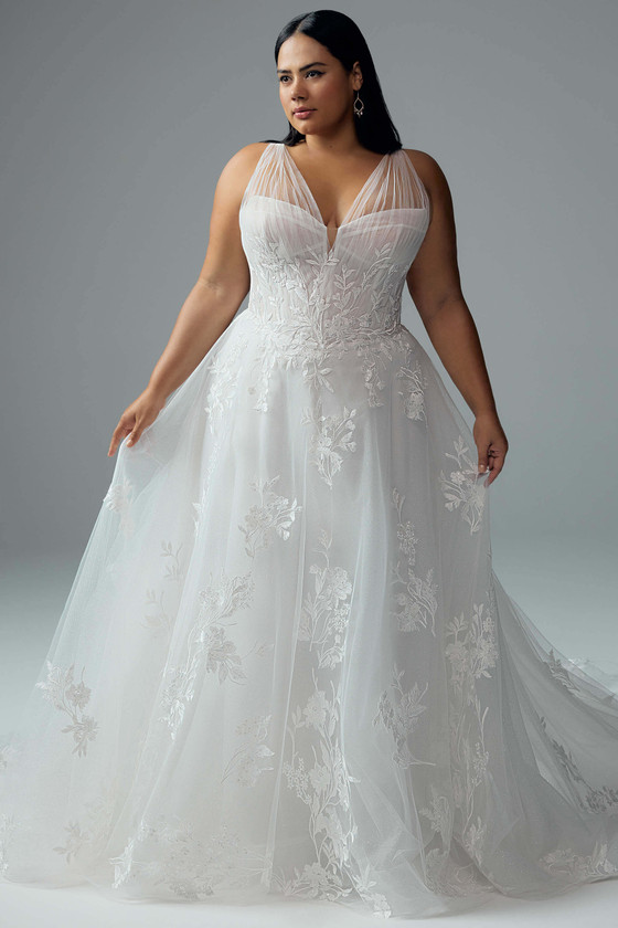 Full front view of Sophia Tolli Y3193, an A-line lace and tulle gown with sheer V-neck bodice, floral appliqués, and flowing skirt