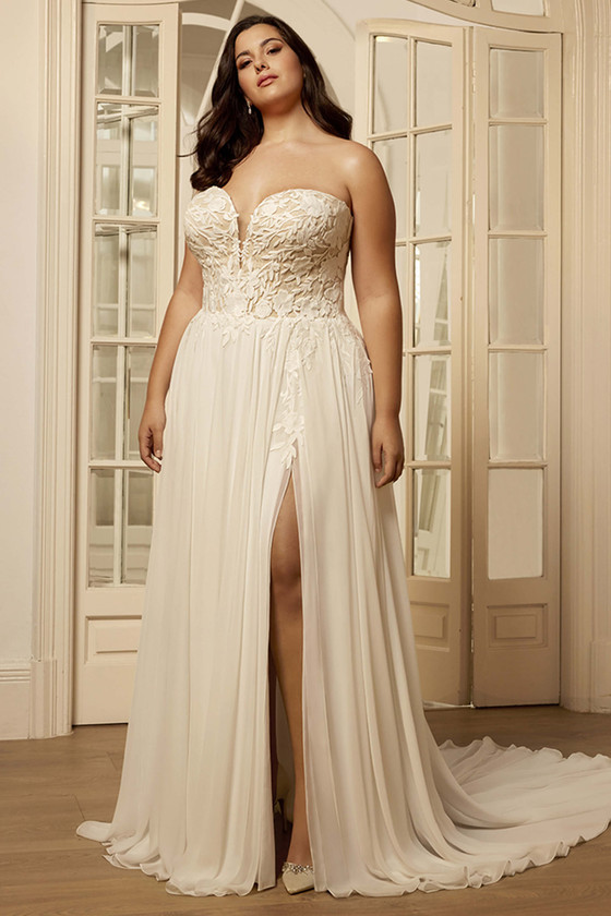 Front view of the Portrait by Enzoani Bethenny plus-size A-line gown with plunging neckline and chiffon slit skirt.