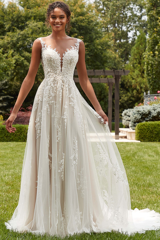 Front view of Morilee Phillippa A-line gown with plunging illusion bodice.