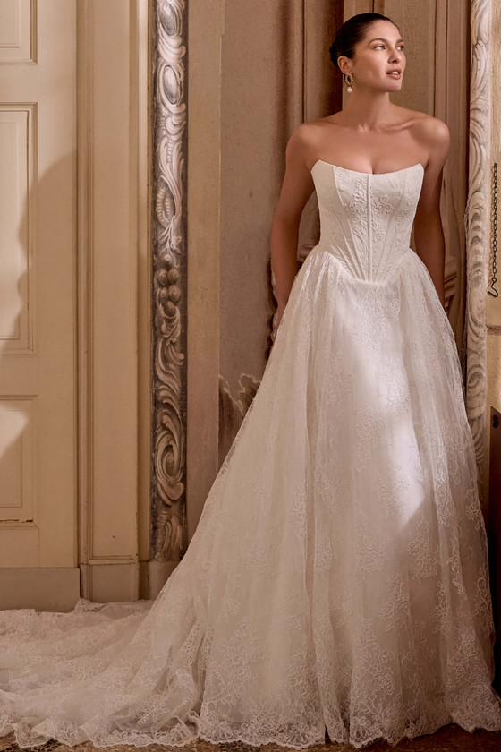 Justin Alexander Leighton A-line wedding gown in ivory corded Alençon lace with scoop neckline and basque waist.