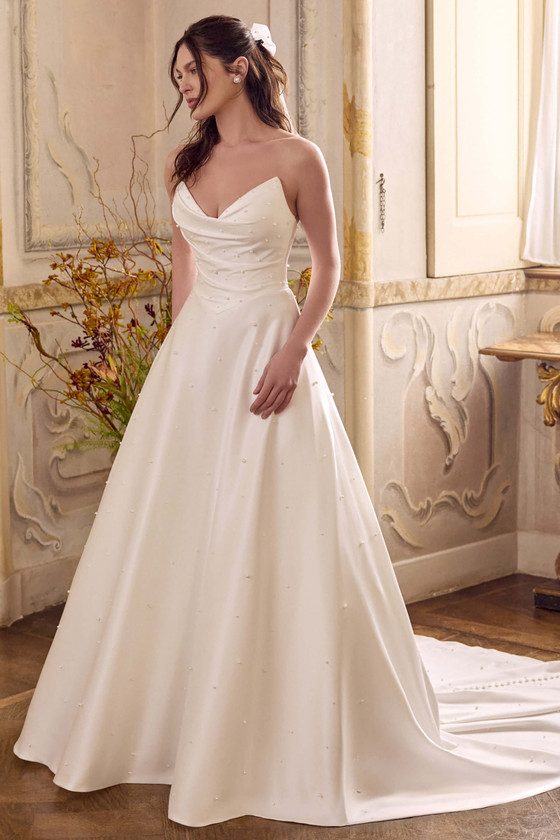 Justin Alexander Lizzie pearl charmeuse wedding gown showcasing hidden pockets and timeless silhouette.