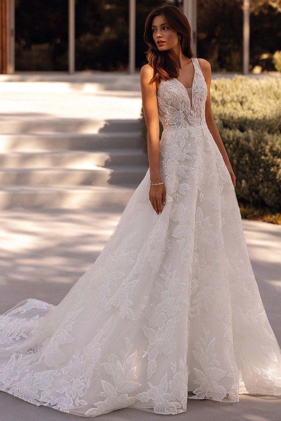 Demetrios Style 1504 A-line wedding dress with plunging V-neckline, floral embroidery, and layered tulle skirt.