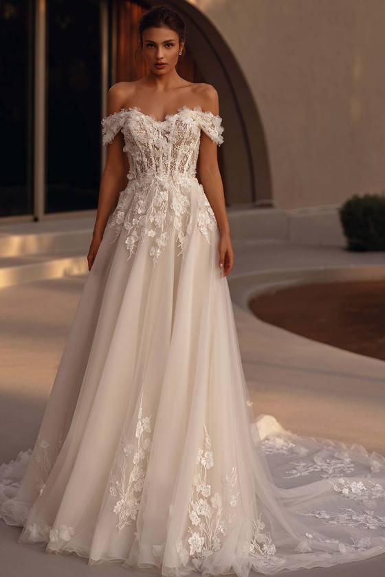 Demetrios Style 1507 A-line wedding dress with off-the-shoulder neckline, floral lace bodice, and flowing tulle skirt.