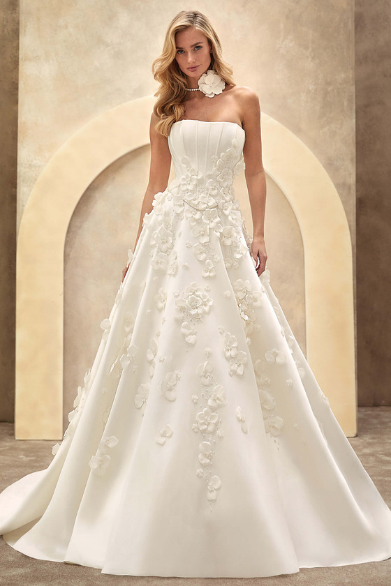 Demetrios Style 1530 A-line wedding dress with strapless corset bodice and cascading 3D floral appliqués.