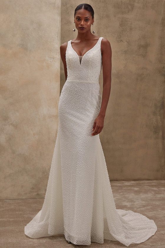 Demetrios Style 1533 sheath wedding dress with plunging V-neckline and allover pearl-beaded tulle.