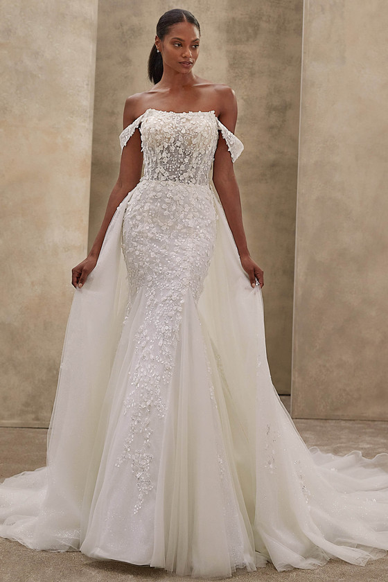 Demetrios Style 1534 wedding dress styled with detachable overskirt for added volume and dramatic impact.