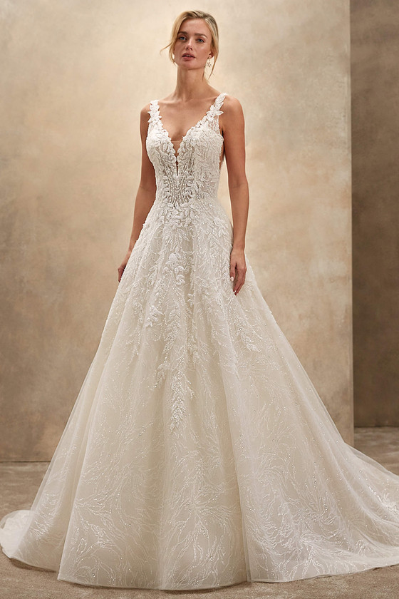 Demetrios Style 1543 A-line wedding dress with deep V-neckline, delicate straps, and luminous beaded tulle.