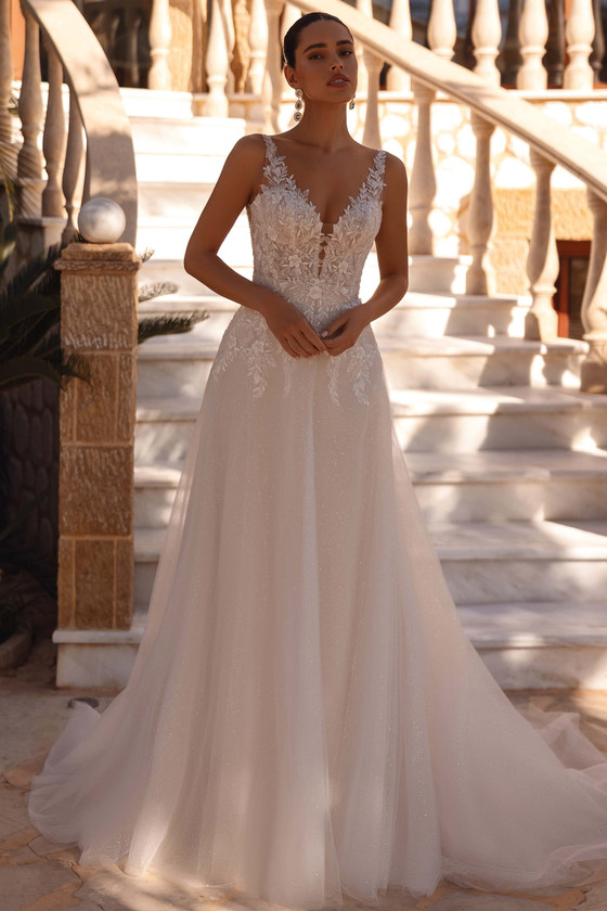 Demetrios Style 8277 A-line wedding dress with illusion neckline, beaded lace bodice, and flowing sparkling tulle skirt.