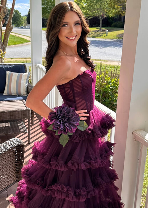Beautiful prom customer in a Plum ruffle A-line dress