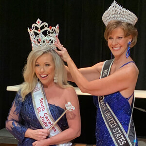 Mrs. pageant crowning moment with contestants in elegant blue gowns