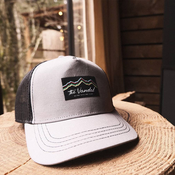 The Vandal grey and black trucker cap with mountain design logo