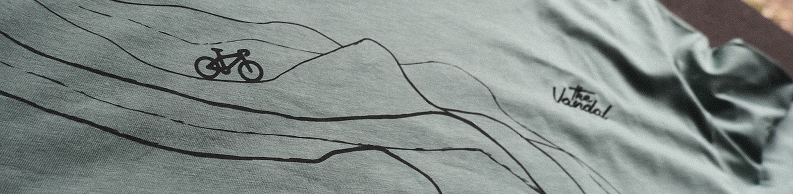 Close-up of The Vandal t-shirt with mountain bike graphic design