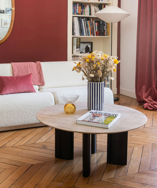 Round travertine and black legs coffee table
