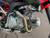 2024 Piranha Daytona 190-4V DE (Dual Exhaust), a high-performance competition pit bike designed for serious riders. The bike features a sleek and aggressive design with a dual exhaust system, emphasizing its power and performance. The Daytona Anima 190 4-valve engine and oversized oil cooler are highlighted, showcasing the bike’s robust power and efficient cooling. The ENGI adjustable suspension (800mm front forks and 330mm rear shock) is prominently displayed, underscoring the bike’s superior handling and shock absorption. The 14-inch front and 12-inch rear aluminum rims with Kenda Carlsbad tires add to the bike’s durability and traction. Overall, the image captures the essence of a high-performance, competition-ready pit bike built to dominate the track.