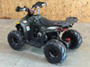 Matte green Denago Mudhawk 6 youth ATV with 107cc 4-stroke engine, automatic F-N-R transmission, LED headlights, rear cargo rack, independent front suspension, and remote wireless shut-off for kids aged 6 and up.