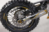 "The Denago MX2 Yellow Edition pit bike features a 125cc engine with 4-speed transmission, hydraulic disc brakes, and adjustable suspension. Shown with vibrant yellow accents on CNC components, black powder-coated wheels, and aggressive knobby tires, this performance bike offers inverted forks, folding levers, and stainless exhaust. Perfect for trail riding with 14.5" ground clearance."