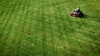 The TORO 42" TimeCutter® Zero Turn Mower in action, effortlessly maneuvering around trees and obstacles with its 42" stamped steel deck and 22 HP Briggs & Stratton engine. Highlighting its wide 18" rear tires, handcrafted seat, step-through front end, and Smart Speed® controls. Perfect for homeowners with up to 2 acres of lawn.