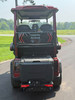 Evolution D-MAX GT4 luxury electric golf cart with forward-facing design, black automotive-grade seats, 10.1-inch touchscreen with CarPlay, 24-speaker audio system, LED lighting, and aluminum wheels, built for performance and style.