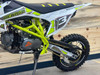 "The Denago MX3 Lime Edition pit bike features a 140cc engine with 4-speed transmission, hydraulic disc brakes, and adjustable suspension. Shown with vibrant lime green accents on CNC components, black powder-coated wheels, and aggressive knobby tires, this performance bike offers inverted forks, folding levers, and stainless exhaust. Perfect for serious trail riding with 14.5" ground clearance."