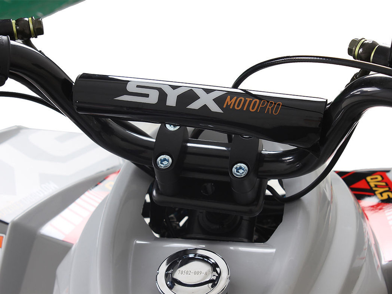 The image showcases the Syx Moto SY70, a sleek and rugged off-road motorcycle designed for young riders and adventure enthusiasts. The bike features a modern grey color scheme with upgraded plastics, a robust frame, and aggressive off-road tires. Key details include the 70cc engine, hydraulic disc brakes, and ergonomic design elements like the easy-reach brake levers and redesigned thumb throttle. The image highlights the bike's durability, performance, and user-friendly features, making it an ideal choice for off-road adventures. The image showcases the Syx Moto SY70, a sleek and rugged off-road motorcycle designed for young riders and adventure enthusiasts. The bike features a modern grey color scheme with upgraded plastics, a robust frame, and aggressive off-road tires. Key details include the 70cc engine, hydraulic disc brakes, and ergonomic design elements like the easy-reach brake levers and redesigned thumb throttle. The image highlights the bike's durability, performance, and user-friendly features, making it an ideal choice for off-road adventures.
