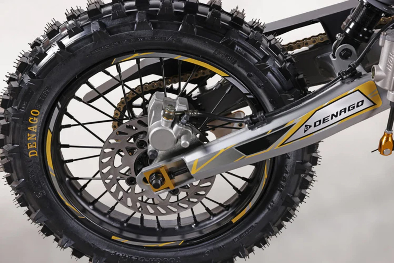 "The Denago MX2 Yellow Edition pit bike features a 125cc engine with 4-speed transmission, hydraulic disc brakes, and adjustable suspension. Shown with vibrant yellow accents on CNC components, black powder-coated wheels, and aggressive knobby tires, this performance bike offers inverted forks, folding levers, and stainless exhaust. Perfect for trail riding with 14.5" ground clearance."