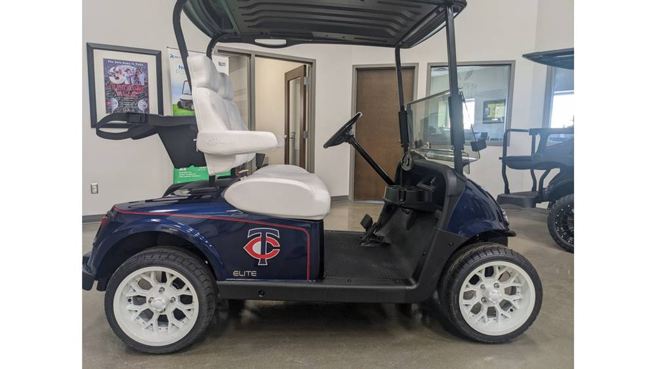 This professionally reconditioned 2018 E-Z-GO RXV ELiTE Lithium golf cart features official Minnesota Twins branding, luxury seats, custom wheels and maintenance-free lithium power. A unique collector's item with like-new performance.