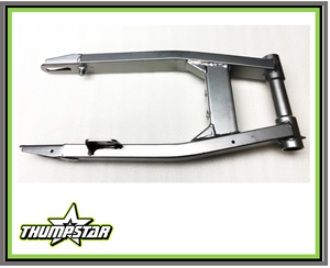 This image showcases the 1004 Swingarm, a high-performance cast alloy component designed for the TSB250 pit bike. The swingarm features a durable cast alloy construction, a sleek silver finish, and a precision-engineered design for seamless fitment. Its lightweight yet rigid design enhances stability, control, and overall performance, making it a must-have upgrade for pit bike enthusiasts and competitive racers. This image showcases the 1004 Swingarm, a high-performance cast alloy component designed for the TSB250 pit bike. The swingarm features a durable cast alloy construction, a sleek silver finish, and a precision-engineered design for seamless fitment. Its lightweight yet rigid design enhances stability, control, and overall performance, making it a must-have upgrade for pit bike enthusiasts and competitive racers.