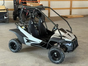 The image showcases the Hammerhead by Polaris MudHead SE, a sleek and stylish go-kart designed for young adventurers aged 10 and up. The go-kart features a modern design with upgraded plastic body panels and a steel bumper, emphasizing its durability and style. The 208cc LCT electric-start engine is highlighted, showcasing the go-kart's power and ease of use. The dual LED headlights and canopy top are visible, adding to the go-kart's functional and stylish design. The ROPS roll cage and three-point safety belts are prominently displayed, underscoring the go-kart's commitment to safety. The 16-inch tires and rear hydraulic disc brake ensure excellent traction and reliable stopping power. Overall, the image captures the essence of a safe, durable, and fun go-kart ready for endless adventures.