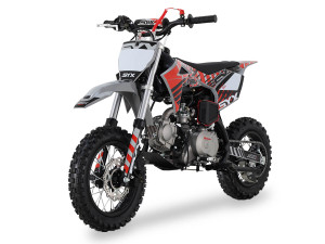A young rider confidently navigates a dirt trail on the 2025 Syx Moto PAD90 youth pit bike. The bike, shown in its dynamic design, features black steel rims with knobby off-road tires, a robust frame, and a sleek number plate. The prominent hydraulic disc brakes and adjustable suspension are visible, highlighting its safety and performance features. The rider is wearing a helmet and protective gear, emphasizing the fun and safety of the off-road experience. A young rider confidently navigates a dirt trail on the 2025 Syx Moto PAD90 youth pit bike. The bike, shown in its dynamic design, features black steel rims with knobby off-road tires, a robust frame, and a sleek number plate. The prominent hydraulic disc brakes and adjustable suspension are visible, highlighting its safety and performance features. The rider is wearing a helmet and protective gear, emphasizing the fun and safety of the off-road experience.