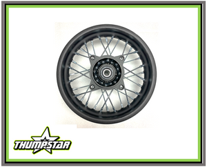 "High-performance 7926 rear rim assembly featuring black steel rim with chrome spokes for Thumpstar TSK models. Complete 1.85x10" disc brake wheel assembly ready for motocross, pit bike racing, and aggressive trail riding. Direct fit for TSK50, TSK70, TSK90 models."