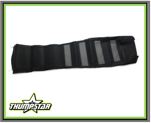 This image showcases the 3056 Seat Cover, a high-grade vinyl seat cover designed for Thumpstar Version 5 pit bike models and CRF110. The seat cover features a superior grip and anti-slip material, ensuring a secure and comfortable riding experience. Its stylish black and grey stripe design adds a touch of elegance to your pit bike, making it a must-have upgrade for enthusiasts and competitive racers. This image showcases the 3056 Seat Cover, a high-grade vinyl seat cover designed for Thumpstar Version 5 pit bike models and CRF110. The seat cover features a superior grip and anti-slip material, ensuring a secure and comfortable riding experience. Its stylish black and grey stripe design adds a touch of elegance to your pit bike, making it a must-have upgrade for enthusiasts and competitive racers.