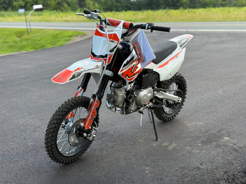 The Kayo TD110 EFI Pit Bike features a sleek, aggressive design with a black and red color scheme, inverted front forks, knobby off-road tires, and a high-mounted exhaust. The EFI fuel system, hydraulic disc brakes, and reinforced steel frame make this mini dirt bike a top choice for performance-oriented riders