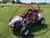 2024 Hammerhead by Polaris GTS Platinum Edition, a high-performance off-road go-kart designed for adventure. The go-kart features a sleek, rugged design with brushed aluminum wheels, a canopy top, and all-wheel fenders. The nitrogen gas shocks and dual A-arm suspension system are prominently visible, highlighting its advanced engineering. The digital speedometer, dual headlights, and brush guard add to its modern and functional appeal. The go-kart is shown in an off-road setting, ready to tackle any terrain with confidence and style.