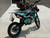 SYX MotoPro PAD190-V2 190cc Pit Bike in one of its two available color options: Red with Grey or Teal with Black. The bike features a sleek and modern design with upgraded plastic kits and a new muffler with a chrome pipe and anti-scalding sheet. The inverted front fork and SX rear shock absorber are prominently displayed, highlighting the bike's advanced suspension system. The heavy-duty black steel rims with deep-teeth pattern off-road tires and hydraulic disc brakes are visible, emphasizing the bike's durability and safety features. The handlebar with a built-in air filter and the SY new forged triple clamp add to the bike's premium feel. The SY V2 double tube cradle frame and SY steel swing arm (knife-shape) are also showcased, underscoring the bike's robust construction. Overall, the image captures the essence of a high-performance, stylish, and durable pit bike ready for any off-road adventure. SYX MotoPro PAD190-V2 190cc Pit Bike in one of its two available color options: Red with Grey or Teal with Black. The bike features a sleek and modern design with upgraded plastic kits and a new muffler with a chrome pipe and anti-scalding sheet. The inverted front fork and SX rear shock absorber are prominently displayed, highlighting the bike's advanced suspension system. The heavy-duty black steel rims with deep-teeth pattern off-road tires and hydraulic disc brakes are visible, emphasizing the bike's durability and safety features. The handlebar with a built-in air filter and the SY new forged triple clamp add to the bike's premium feel. The SY V2 double tube cradle frame and SY steel swing arm (knife-shape) are also showcased, underscoring the bike's robust construction. Overall, the image captures the essence of a high-performance, stylish, and durable pit bike ready for any off-road adventure.