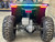 The image features the Denago E-Hawk 6 ATV, a sleek and modern electric ATV designed for kids aged 6 and up. The ATV showcases a bold black finish with multicolored LED lights, giving it a stylish and futuristic look. The rugged all-terrain tires (AT 16 x 8-7) and double A-arm front suspension highlight its capability to handle various terrains, from dirt trails to grassy fields. The handlebar-mounted controls, including the push-button gear selector and keyed ignition, are clearly visible, emphasizing the ATV's user-friendly design. The compact dimensions (51" x 31" x 32.5") and low seat height (23.5") make it perfectly sized for young riders, while the 48V removable lithium-ion battery and 1600W brushless electric motor underscore its eco-friendly and high-performance features. Safety elements like dual hydraulic disk brakes and an anti-theft alarm are subtly integrated into the design. This image captures the essence of the E-Hawk 6 ATV as a safe, fun, and technologically advanced electric vehicle for kids.