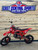 Side View: Red Denago MX2 125cc manual dirt bike side view