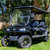 *"RedDot Evolution Classic/Forester tinted folding windshield shown installed on golf cart in both upright and folded positions. Features 3/16" smoke-tinted impact-resistant acrylic, heavy-duty aluminum frame, and precision fitment. Professional wind and sun protection for Evolution golf carts."* *"RedDot Evolution Classic/Forester tinted folding windshield shown installed on golf cart in both upright and folded positions. Features 3/16" smoke-tinted impact-resistant acrylic, heavy-duty aluminum frame, and precision fitment. Professional wind and sun protection for Evolution golf carts."*