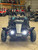 The image showcases the Hammerhead by Polaris MudHead 208R, a versatile and high-performing go-kart designed for young adventurers aged 10 and up. The go-kart features a sleek and durable design with a brush guard at the front for added protection. The 208cc LCT electric-start engine is highlighted, emphasizing the go-kart's power and ease of use. The dual LED headlights and canopy top are visible, showcasing the go-kart's stylish and functional design. The 16 x 6 – 8-inch front tires and 16 x 7 – 8-inch rear tires provide excellent traction and stability, while the rear hydraulic disc brake ensures safe and reliable stopping power. The three-point harness seatbelt adds an extra layer of safety, making it a perfect choice for young riders. Overall, the image captures the essence of a safe, durable, and fun go-kart ready for endless adventures.