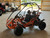 The image showcases the Hammerhead by Polaris MudHead 208R, a versatile and high-performing go-kart designed for young adventurers aged 10 and up. The go-kart features a sleek and durable design with a brush guard at the front for added protection. The 208cc LCT electric-start engine is highlighted, emphasizing the go-kart's power and ease of use. The dual LED headlights and canopy top are visible, showcasing the go-kart's stylish and functional design. The 16 x 6 – 8-inch front tires and 16 x 7 – 8-inch rear tires provide excellent traction and stability, while the rear hydraulic disc brake ensures safe and reliable stopping power. The three-point harness seatbelt adds an extra layer of safety, making it a perfect choice for young riders. Overall, the image captures the essence of a safe, durable, and fun go-kart ready for endless adventures.