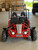 The image showcases the Hammerhead by Polaris MudHead 208R, a versatile and high-performing go-kart designed for young adventurers aged 10 and up. The go-kart features a sleek and durable design with a brush guard at the front for added protection. The 208cc LCT electric-start engine is highlighted, emphasizing the go-kart's power and ease of use. The dual LED headlights and canopy top are visible, showcasing the go-kart's stylish and functional design. The 16 x 6 – 8-inch front tires and 16 x 7 – 8-inch rear tires provide excellent traction and stability, while the rear hydraulic disc brake ensures safe and reliable stopping power. The three-point harness seatbelt adds an extra layer of safety, making it a perfect choice for young riders. Overall, the image captures the essence of a safe, durable, and fun go-kart ready for endless adventures.