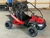 The image showcases the Hammerhead by Polaris MudHead SE, a sleek and stylish go-kart designed for young adventurers aged 10 and up. The go-kart features a modern design with upgraded plastic body panels and a steel bumper, emphasizing its durability and style. The 208cc LCT electric-start engine is highlighted, showcasing the go-kart's power and ease of use. The dual LED headlights and canopy top are visible, adding to the go-kart's functional and stylish design. The ROPS roll cage and three-point safety belts are prominently displayed, underscoring the go-kart's commitment to safety. The 16-inch tires and rear hydraulic disc brake ensure excellent traction and reliable stopping power. Overall, the image captures the essence of a safe, durable, and fun go-kart ready for endless adventures.