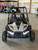 The image showcases the Hammerhead by Polaris MudHead SE, a sleek and stylish go-kart designed for young adventurers aged 10 and up. The go-kart features a modern design with upgraded plastic body panels and a steel bumper, emphasizing its durability and style. The 208cc LCT electric-start engine is highlighted, showcasing the go-kart's power and ease of use. The dual LED headlights and canopy top are visible, adding to the go-kart's functional and stylish design. The ROPS roll cage and three-point safety belts are prominently displayed, underscoring the go-kart's commitment to safety. The 16-inch tires and rear hydraulic disc brake ensure excellent traction and reliable stopping power. Overall, the image captures the essence of a safe, durable, and fun go-kart ready for endless adventures.