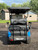 The 2024 MadJax X Series X4 Golf Cart features a sleek, modern design with a bold front grille, LED lighting, and vibrant high-gloss color options. The luxurious interior includes premium seating, USB ports, cup holders, and a folding windshield. With a 3" lift, hydraulic disc brakes, and a powerful 5KW motor, this cart is built for style and performance. The 2024 MadJax X Series X4 Golf Cart features a sleek, modern design with a bold front grille, LED lighting, and vibrant high-gloss color options. The luxurious interior includes premium seating, USB ports, cup holders, and a folding windshield. With a 3" lift, hydraulic disc brakes, and a powerful 5KW motor, this cart is built for style and performance.